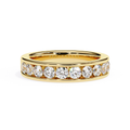 Gold channel set diamond wedding band with round cut stones