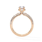 Rose gold ring with a diamond on a white background