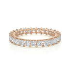 Rose gold diamond wedding ring on a white background