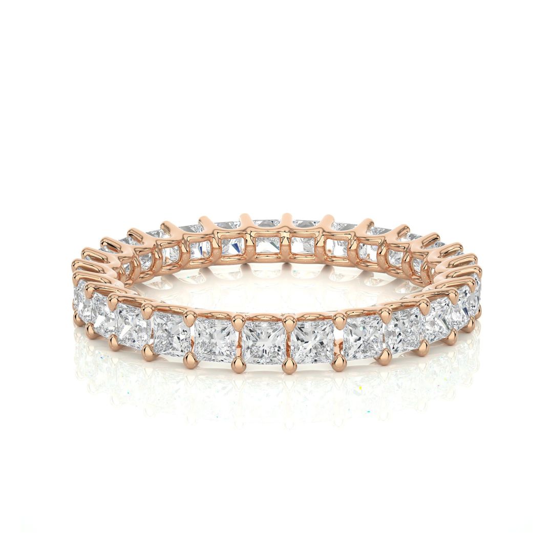 Rose gold diamond wedding ring on a white background