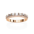 Rose gold wedding band with diamond accents on a white background