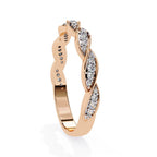 Rose gold band with diamond accents on a white background