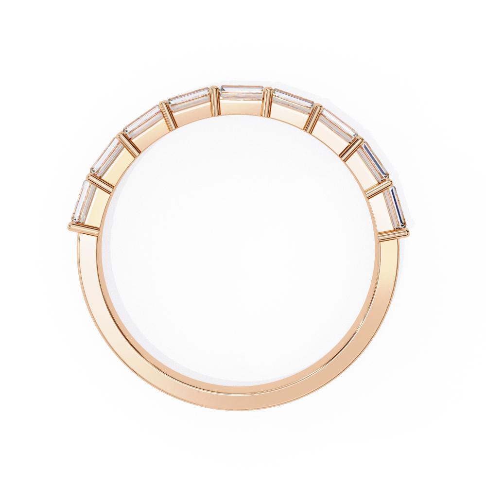 Rose gold wedding ring on a white background