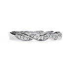 Silver wedding ring with diamond accents on a white background