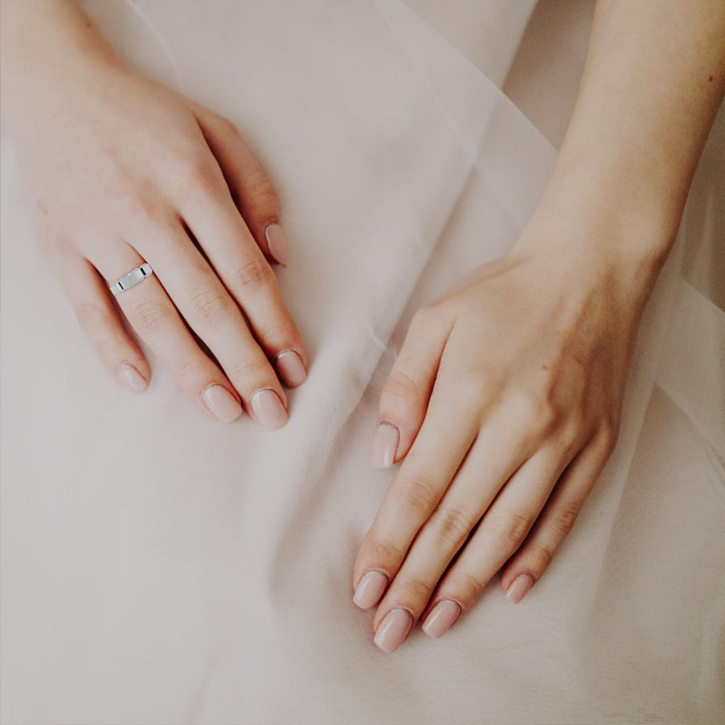 Woman wearing diamond wedding band