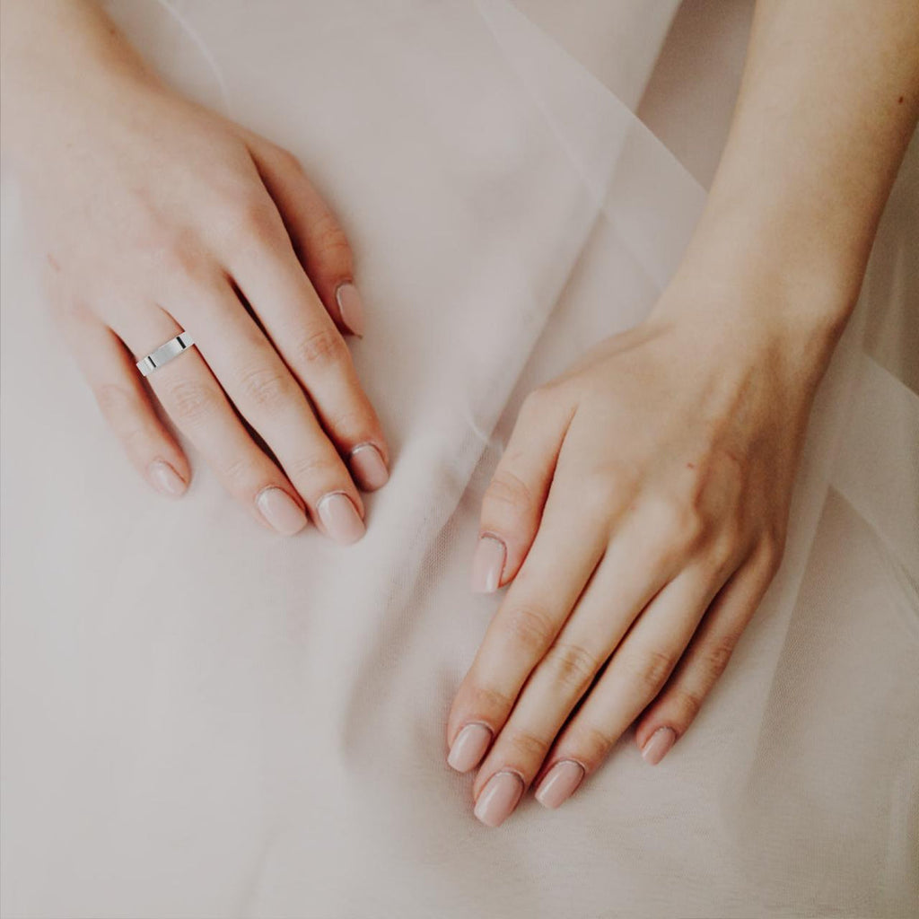 Woman wearing classic wedding band