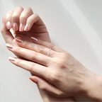 Woman wearing marquise-cut diamond wedding band