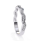 White gold wedding band with diamond accents on a white background