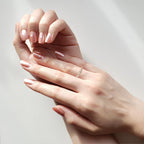 Close-up of a woman wearing a Twisted Multi-Stone Wedding Band in White Gold
