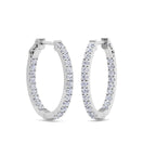 White Gold diamond huggies with round hoop shape