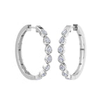 Classic white gold hoop earrings with pear cut diamonds