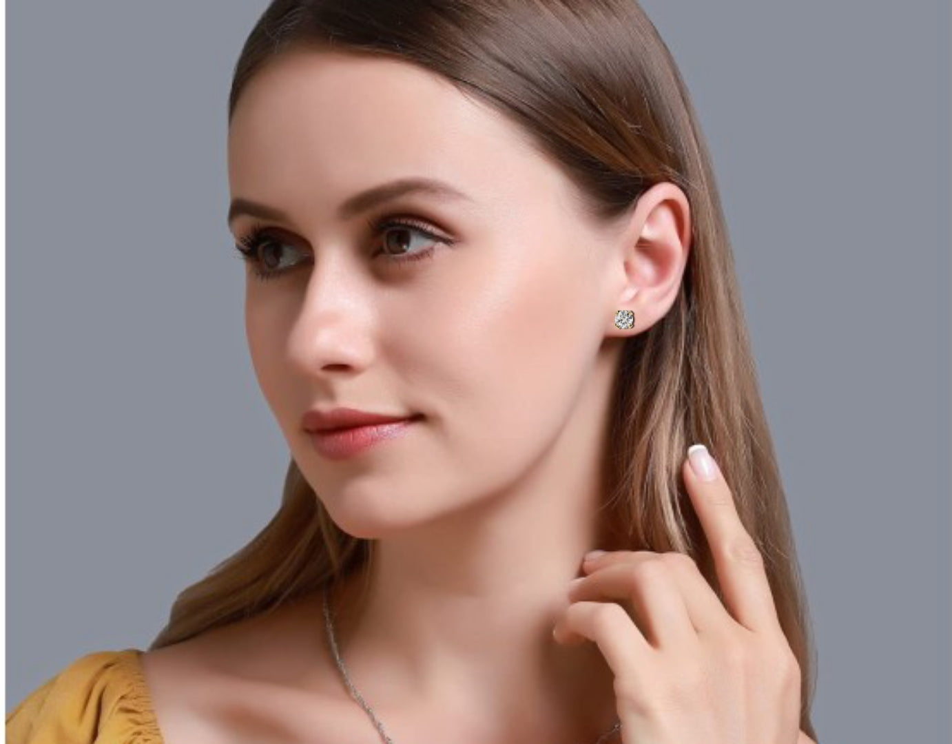 Woman wearing Round cut diamond stud earrings