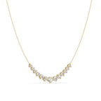 Gold necklace with diamonds on a white background