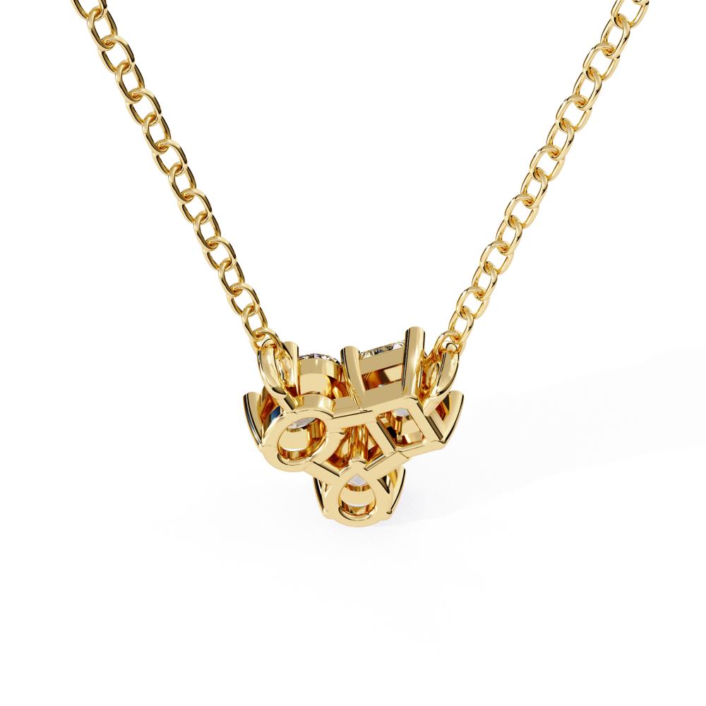 Gold necklace with a unique pendant on a white background