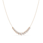 Gold necklace with diamond accents on a white background