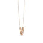 Rose gold necklace with a geometric pendant on a white background