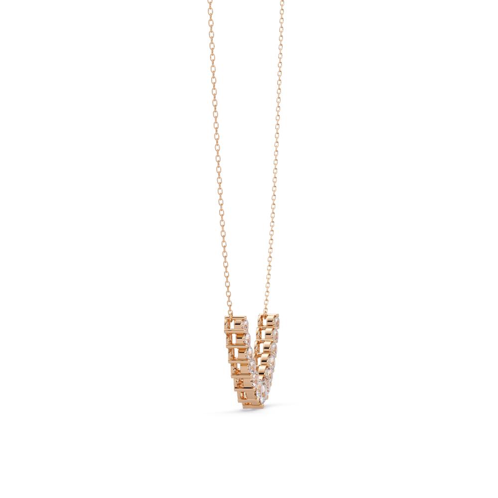 Rose gold necklace with a geometric pendant on a white background