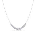 Silver necklace with small diamonds on a white background