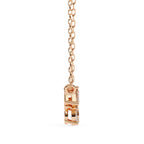 Rose gold pendant on a white background