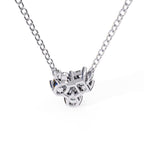 Silver necklace with a detailed pendant on a white background