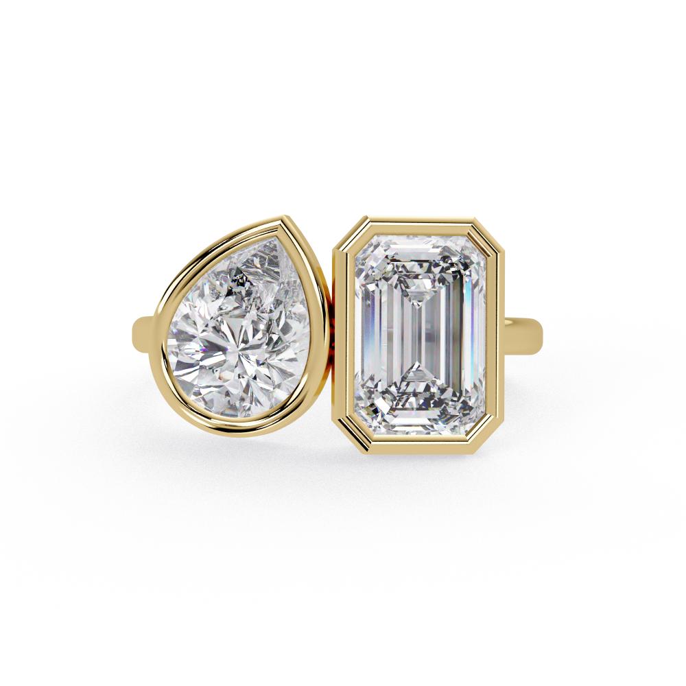 Emerald and pear diamond Toi et Moi bezel engagement ring in gold
