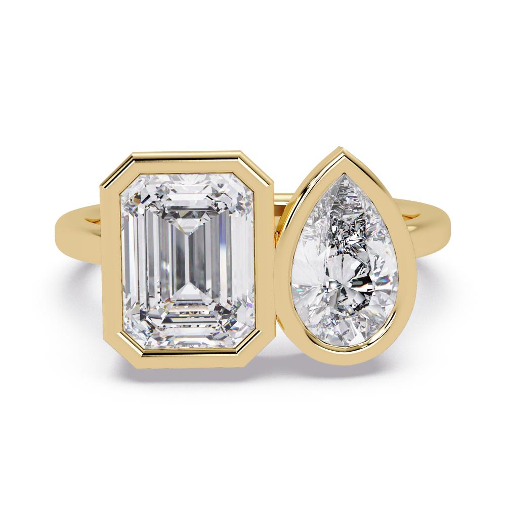 Pear and emerald diamond bezel Toi et Moi engagement ring in gold