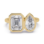 Pear and emerald diamond bezel Toi et Moi engagement ring in gold