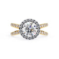 Round halo diamond ring in gold with crossover design