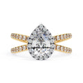 Pear halo diamond ring in gold with crossover design