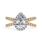 Pear halo diamond ring in gold with crossover design