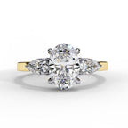 Oval Shape Diamond Ring with Pear Side Stones in Gold