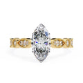 Gold Milgrain Cathedral engagement ring with marquise diamond