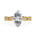 Gold Milgrain Cathedral engagement ring with marquise diamond