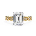 Gold Milgrain Cathedral engagement ring with emerald diamond