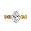 Gold Milgrain Cathedral engagement ring with oval shape diamond