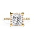 Princess cut diamond halo engagement ring in gold