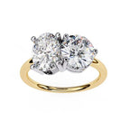Gold engagement ring with oval and round lab grown diamonds