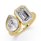 Gold Toi et Moi ring with emerald-cut and pear-shaped diamonds