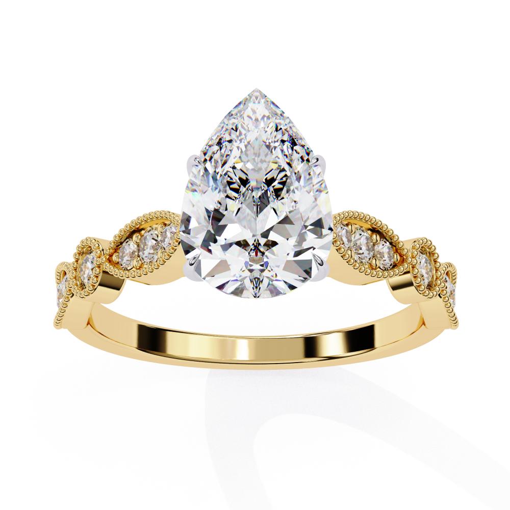 Gold engagement ring with pear diamond and Milgrain details