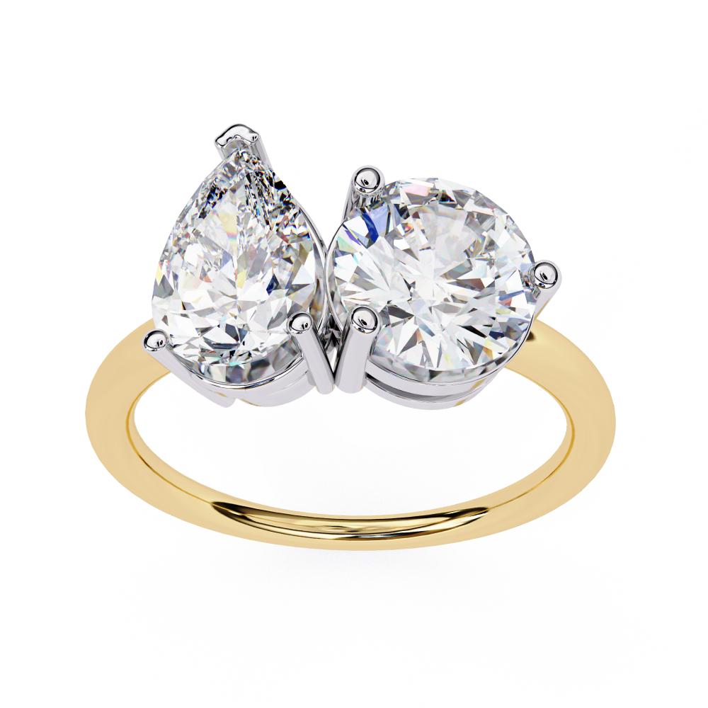Gold engagement ring with pear and round lab grown diamonds