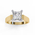 Gold engagement ring featuring a princess cut solitaire diamond