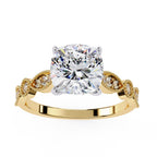 Gold engagement ring with cushion diamond and Milgrain details