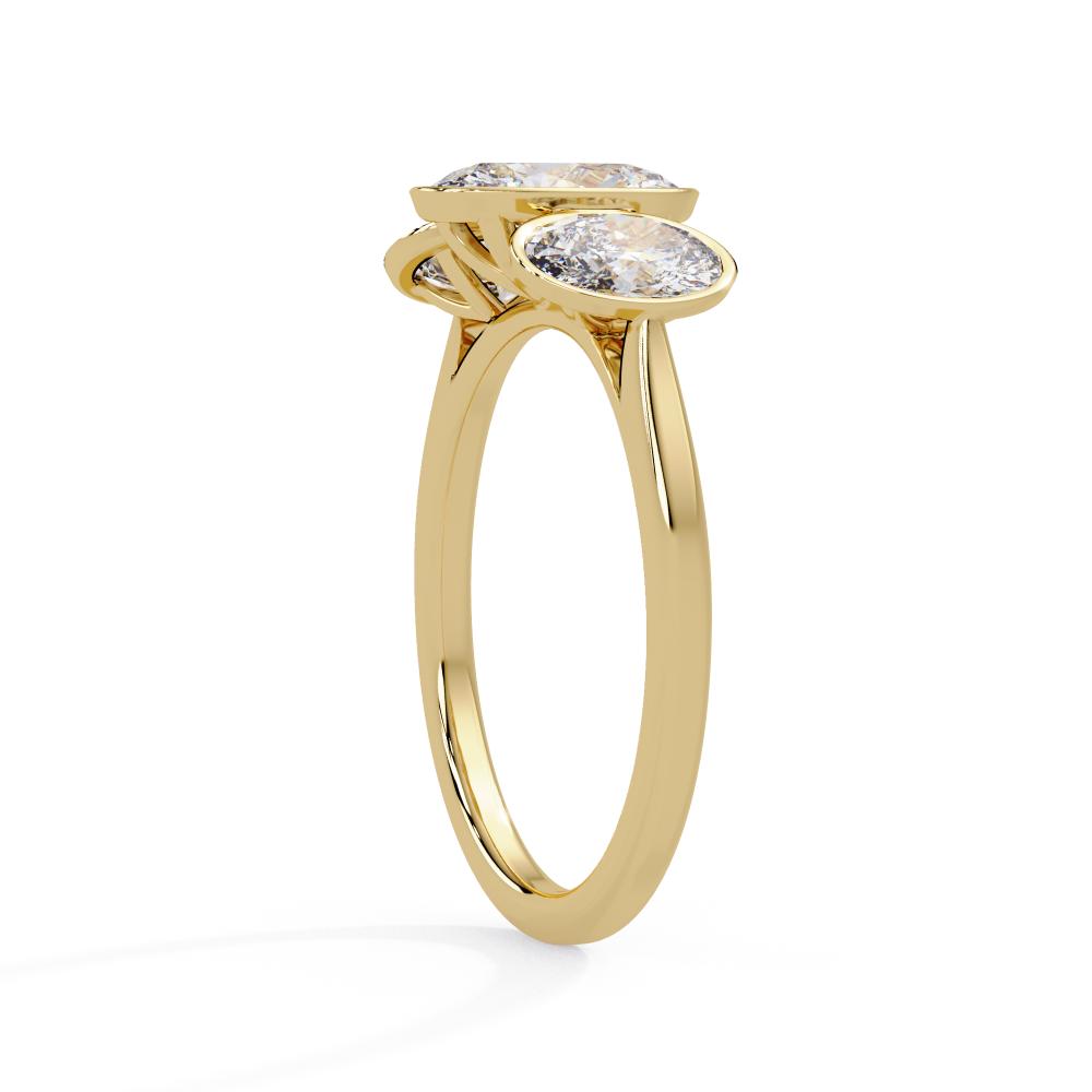 Gold bezel ring with three oval-cut diamonds