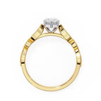 Gold ring with a solitaire diamond on a white background