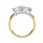 Affordable diamond Toi Et Moi engagement ring with emerald and round diamond