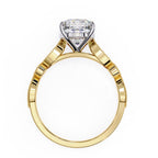 Gold ring with a solitaire diamond on a white background