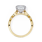 Gold ring with a solitaire diamond on a white background