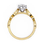 Gold ring with a solitaire diamond on a white background