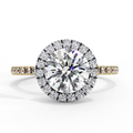 Round halo diamond engagement ring in yellow gold