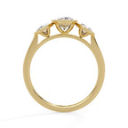 Elegant three-stone oval diamond ring in gold bezel setting
